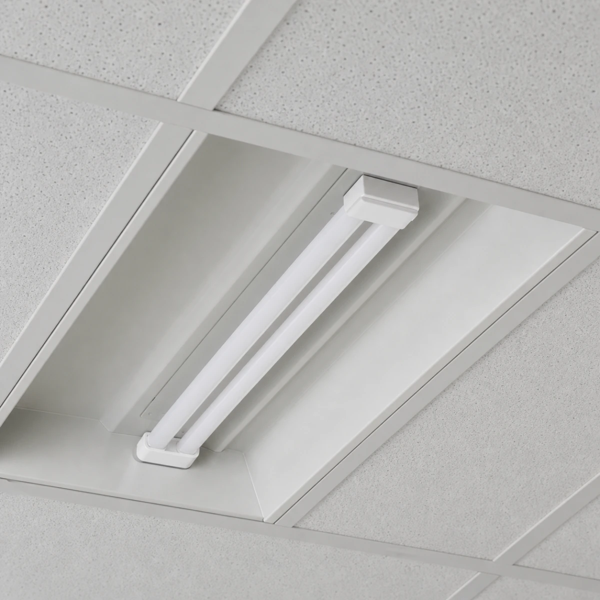 LED H-shaped 2G11 tube fully seated in a recessed office luminaire with no exposed pins