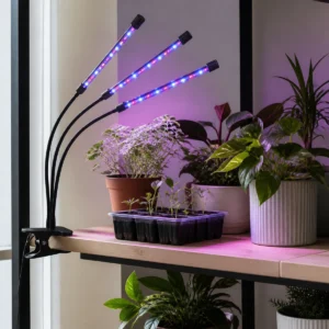 Three-head clamp grow light with flexible bars over indoor plants and seedlings