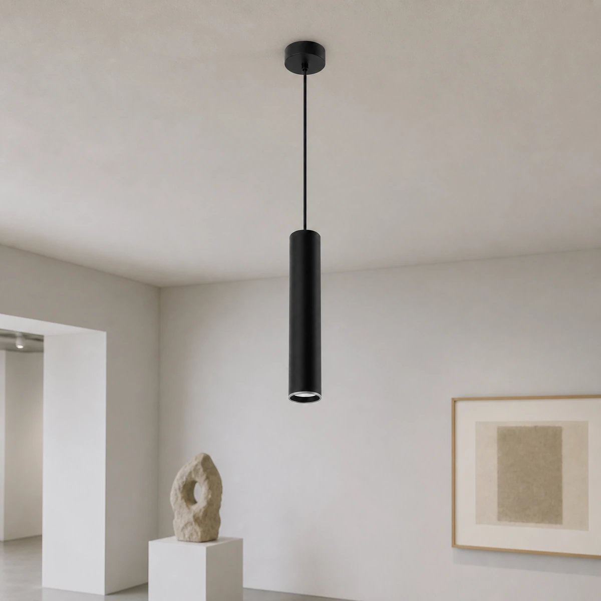 Single black CS51R-1A cylindrical spotlight housing suspended from a dry gallery ceiling