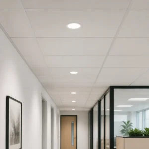 Round side-emission small LED panels installed flush in a dry office corridor ceiling