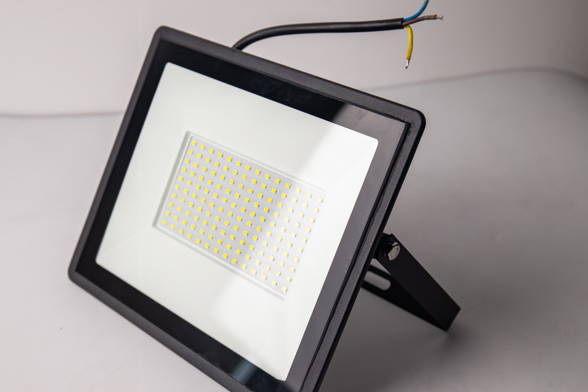 New Lights LED floodlight sample with bracket, cable and front optic visible