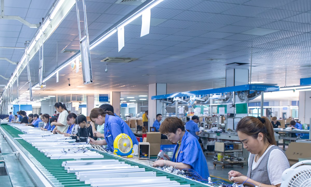 New Lights production team assembling linear lighting products on a factory line