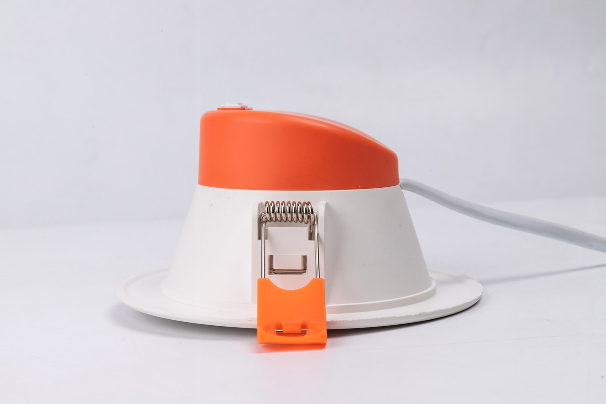 Rear view of a New Lights panel downlight with spring clip and connecting cable