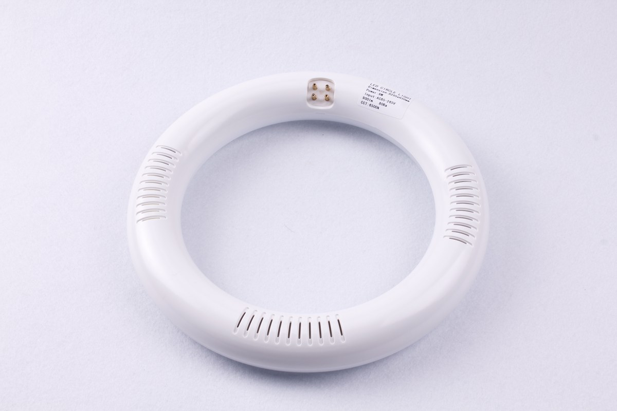 Front view of a New Lights T9 LED circular lamp with four-pin connection