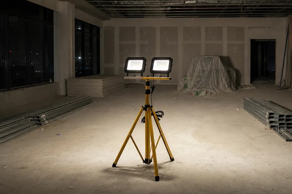 New Lights dual-head tripod work light illuminating a temporary work area