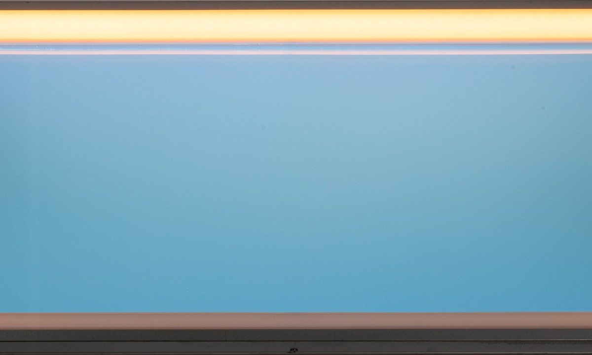 Illuminated P Series artificial skylight panel with blue central plane and warm perimeter light