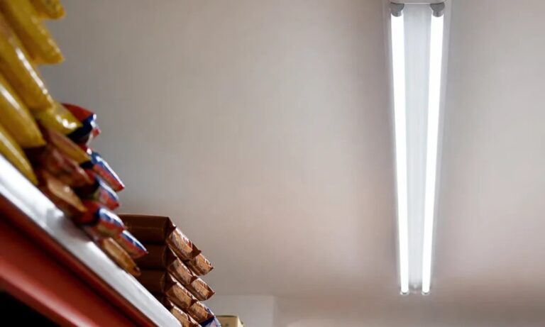 Two T8 LED glass tubes operating in a stockroom ceiling fixture