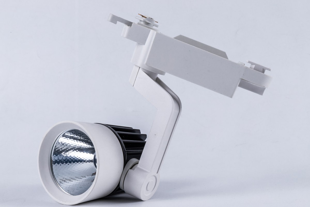 New Lights track-mounted spotlight housing with front reflector and adjustable head